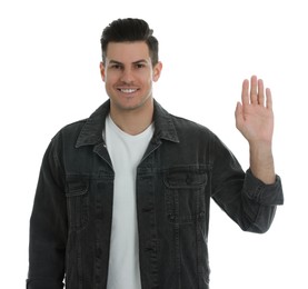 Photo of Cheerful man waving to say hello on white background