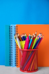 Different school stationery on table against light blue background. Back to school