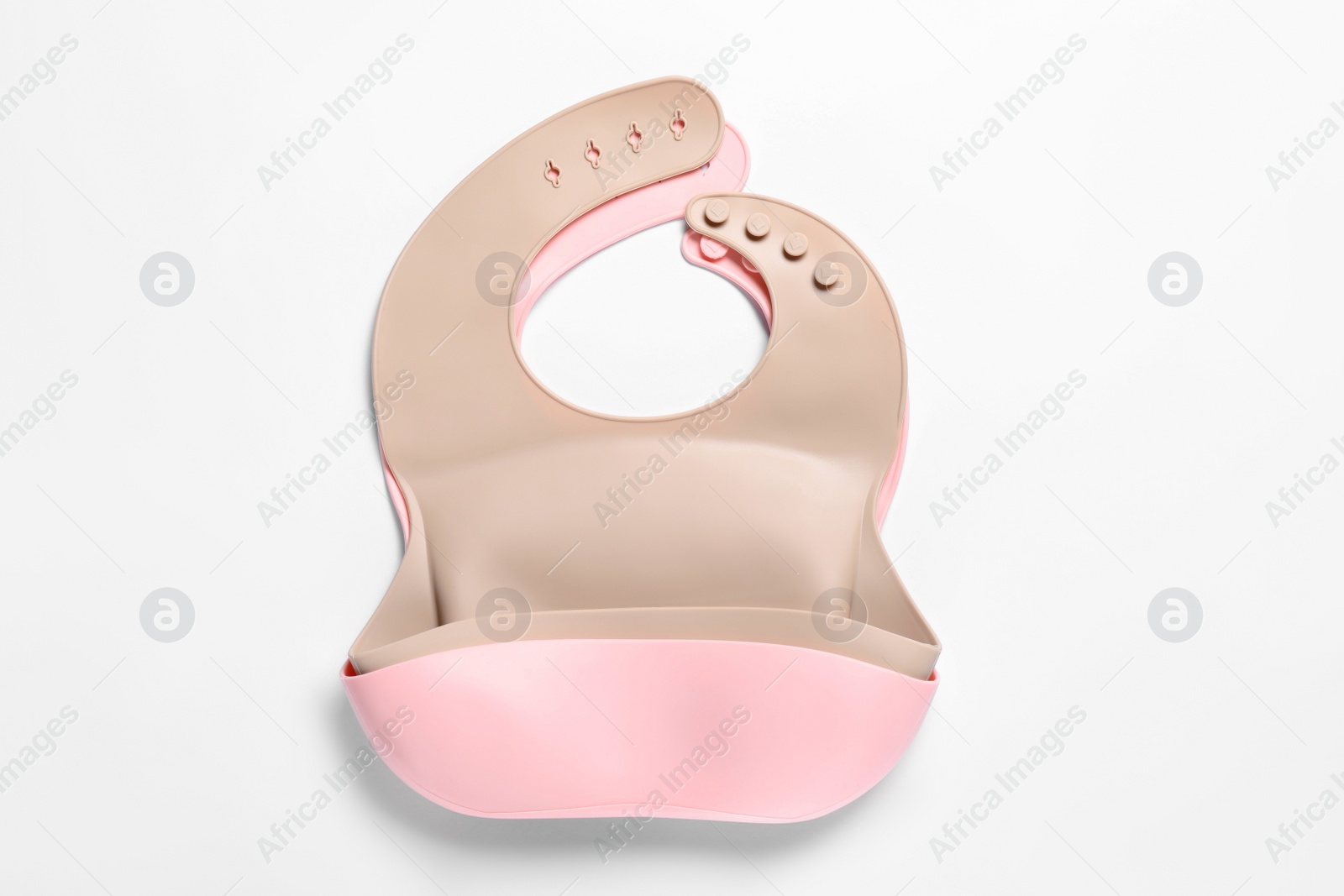 Photo of Color silicone baby bibs isolated on white, top view