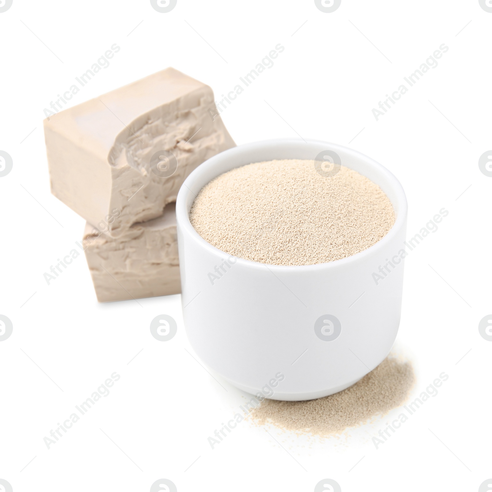 Photo of Compressed and granulated yeast on white background