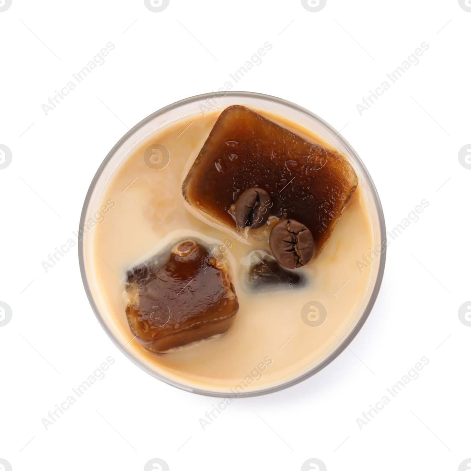 Photo of Glass of milk with coffee ice cubes on white background, top view