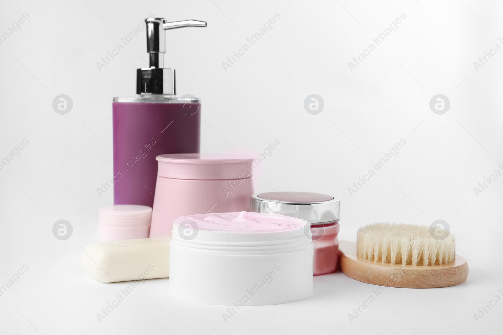 Photo of Different body care products and brush on white background