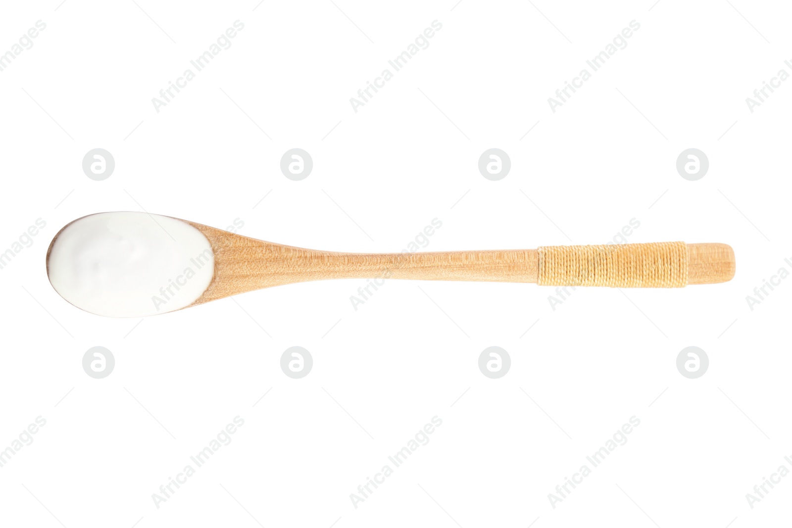 Photo of Wooden spoon with tasty organic yogurt isolated on white, top view