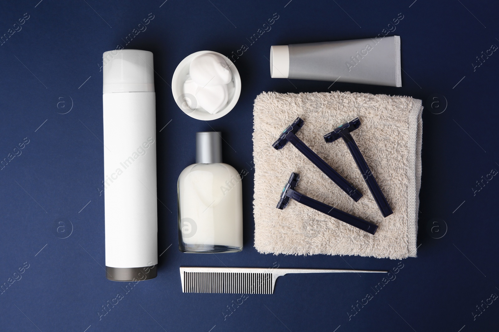 Photo of Flat lay composition with shaving accessories for men on blue background