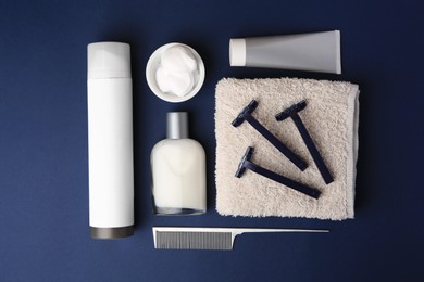 Flat lay composition with shaving accessories for men on blue background