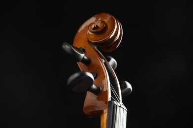 Photo of Beautiful violin on black background, closeup view