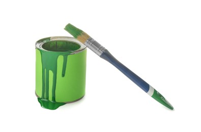 Photo of Can of green paint with brush on white background