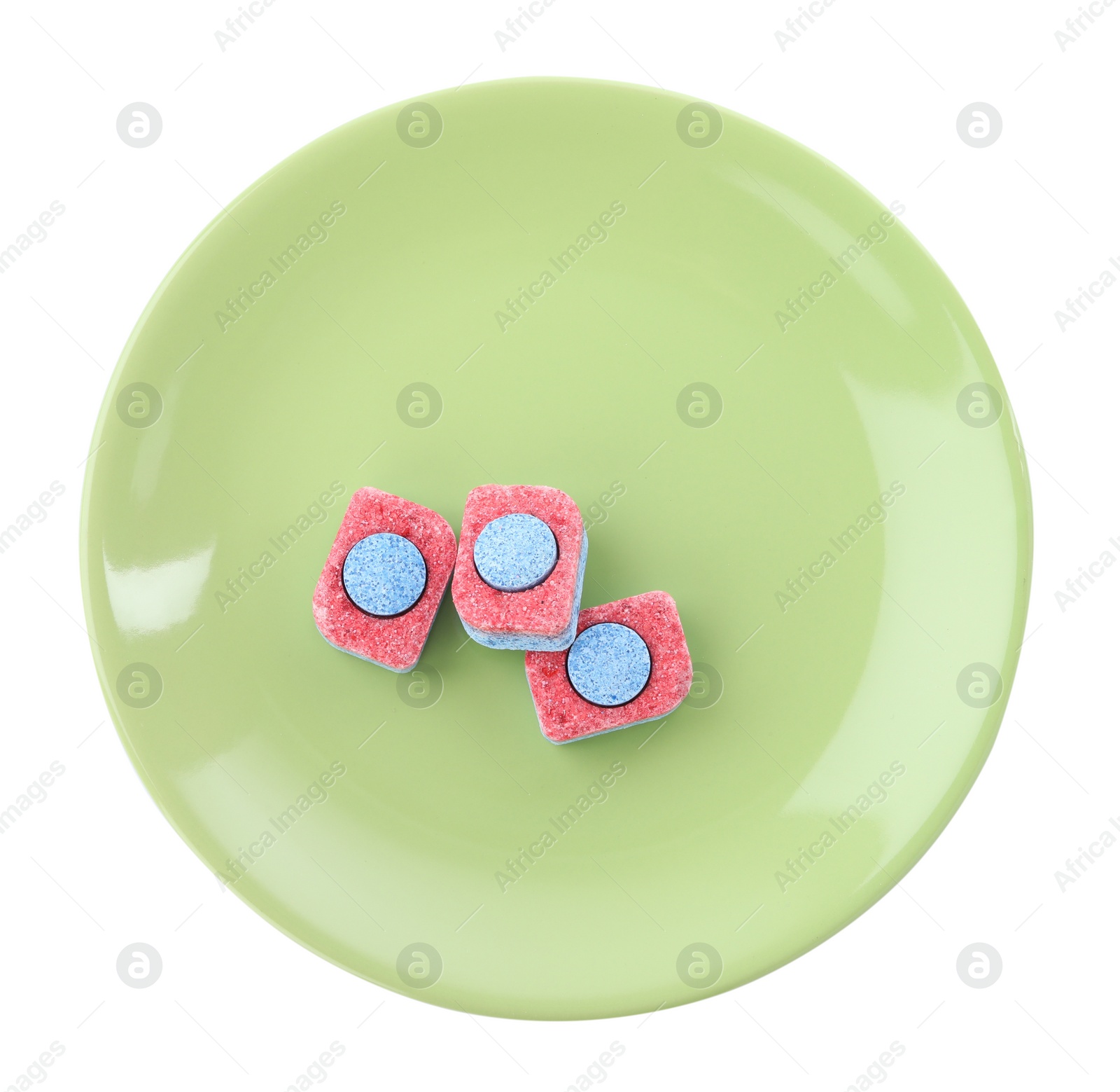 Photo of Green plate with dishwasher detergent tablets on white background, top view