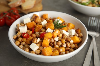 Delicious fresh chickpea salad on grey table