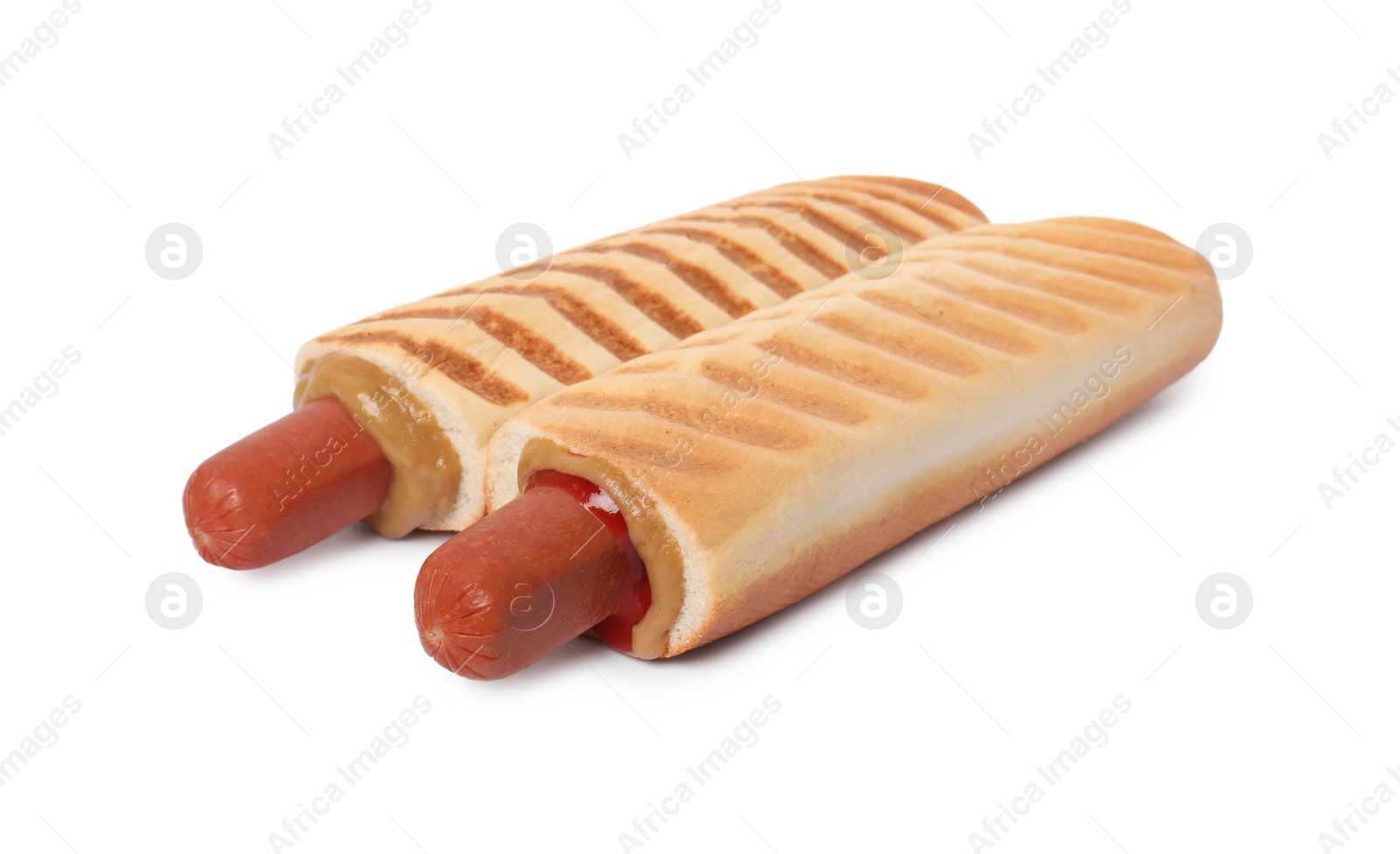 Photo of Tasty french hot dogs with mustard and ketchup isolated on white