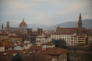 Florence, Italy - February 8, 2024: Picturesque view of city with beautiful buildings and mointains