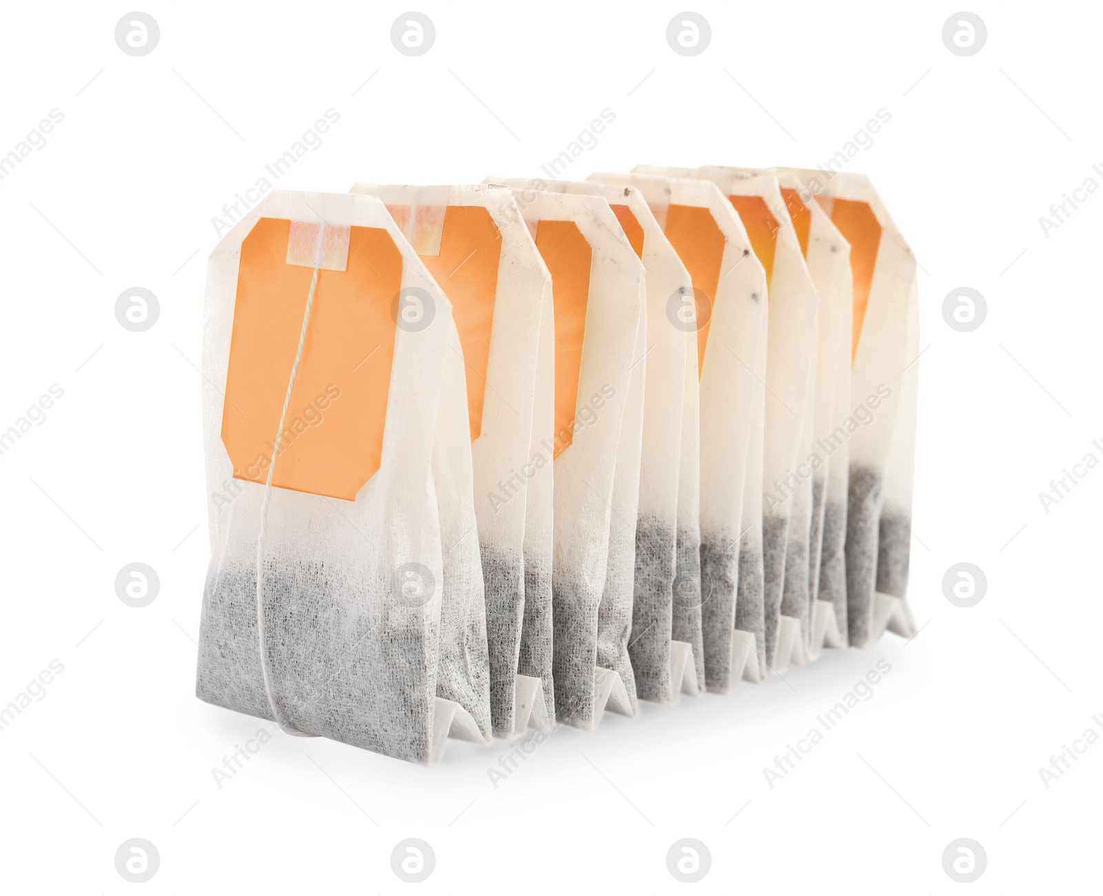 Photo of Many new tea bags on white background