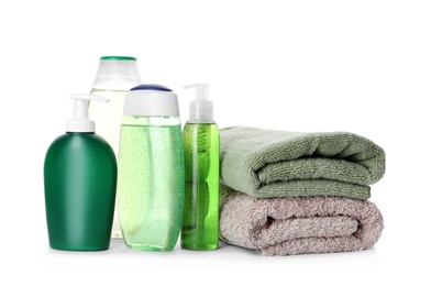 Photo of Personal hygiene products and towels on white background