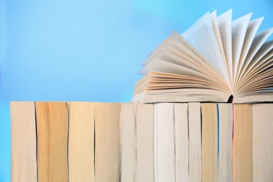 Collection of books on light blue background
