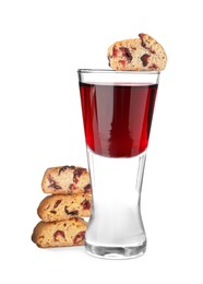 Photo of Tasty cantucci with berries and glass of liqueur on white background. Traditional Italian almond biscuits