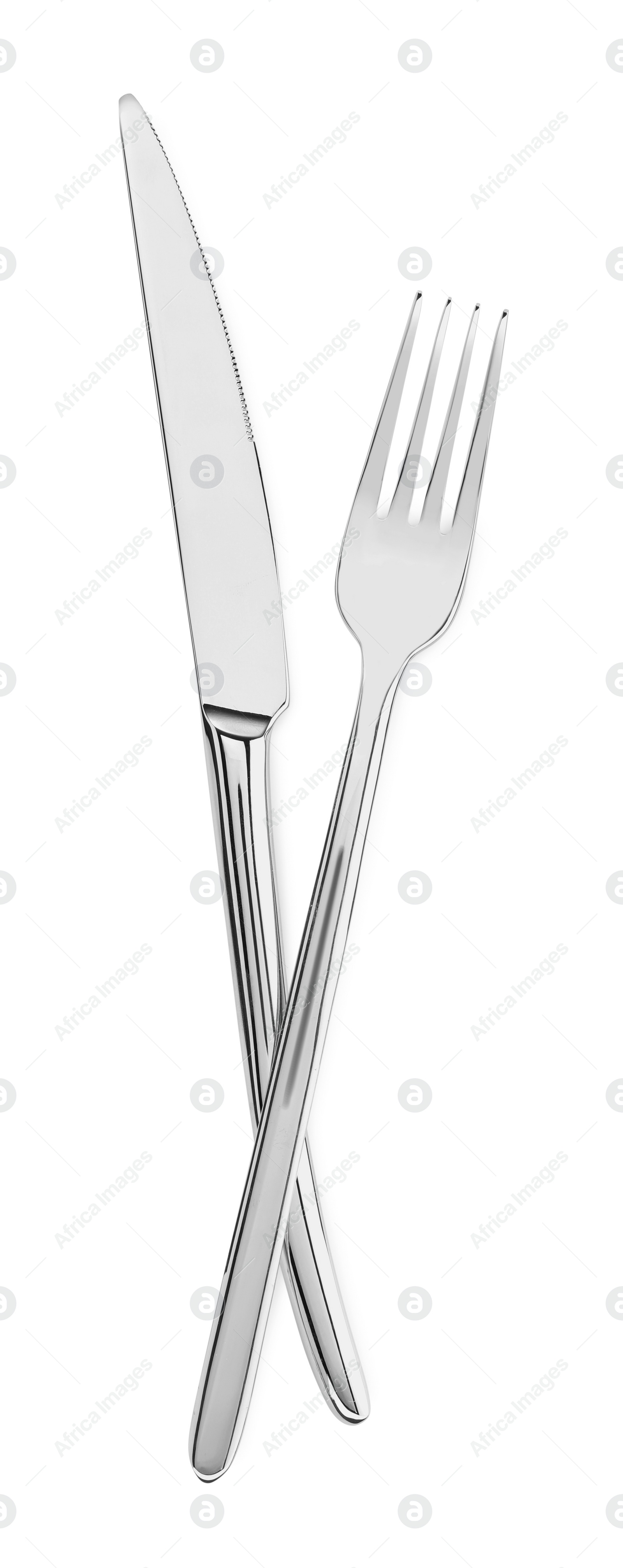 Photo of Fork and knife isolated on white, top view. Stylish shiny cutlery set