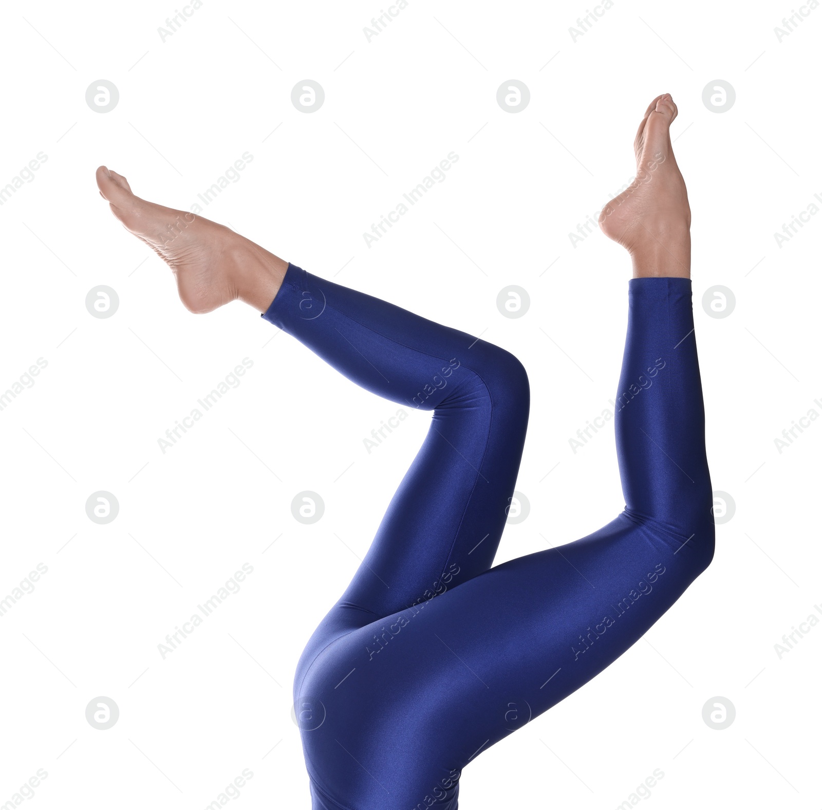 Photo of Woman with beautiful long legs wearing blue leggings on white background, closeup