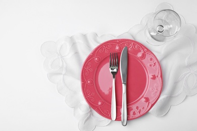 Elegant table setting on white background, top view