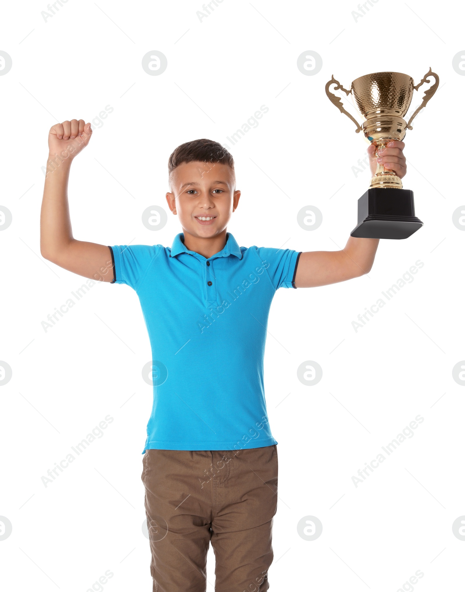 Photo of Happy boy with golden winning cup on white background