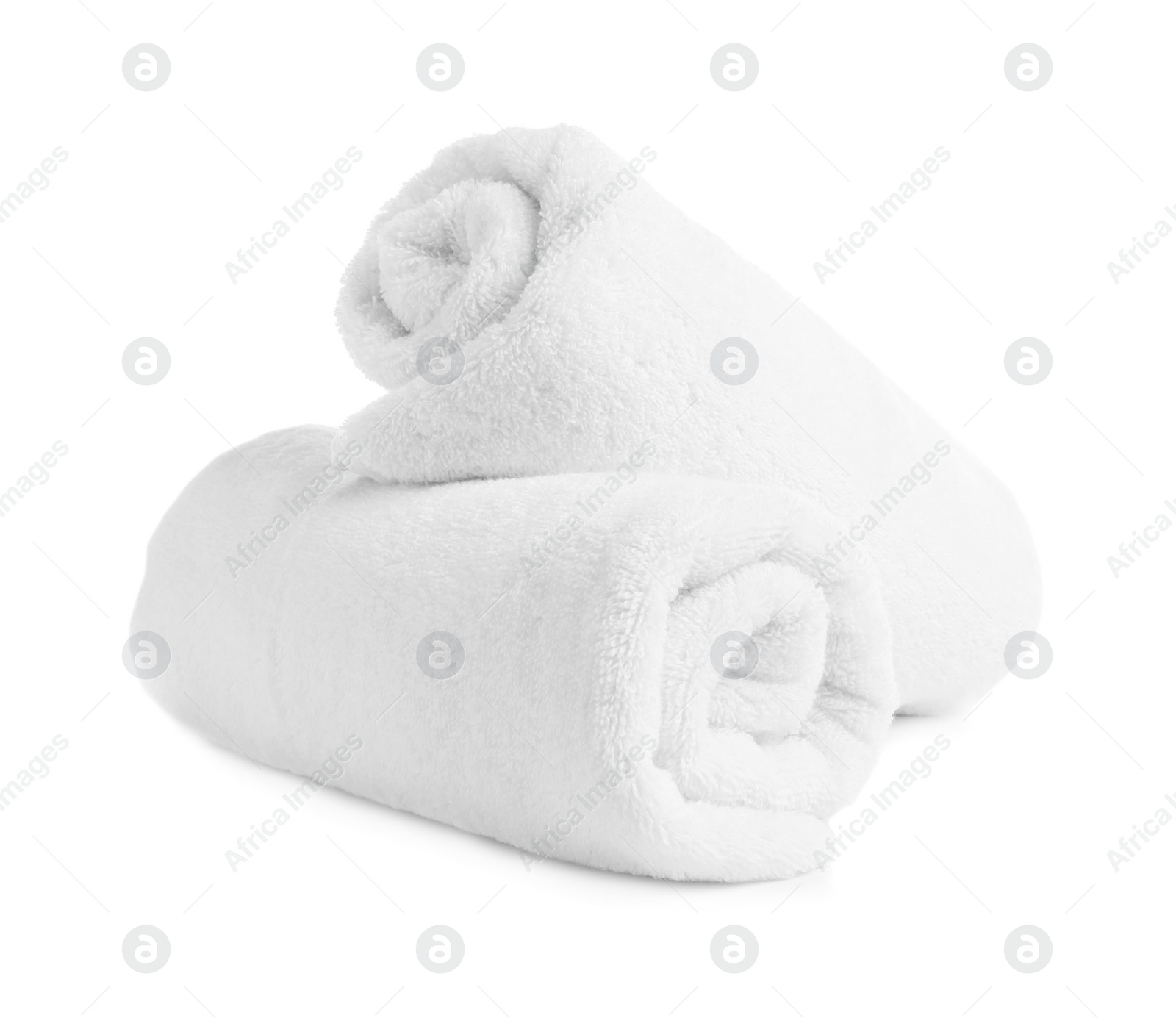 Photo of Rolled soft terry towels on white background