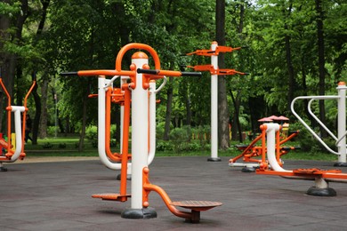 Empty outdoor gym with air walker, ovate stepper, twister and surfer