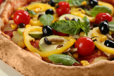 Photo of Delicious fresh vegetable pizza on board, closeup