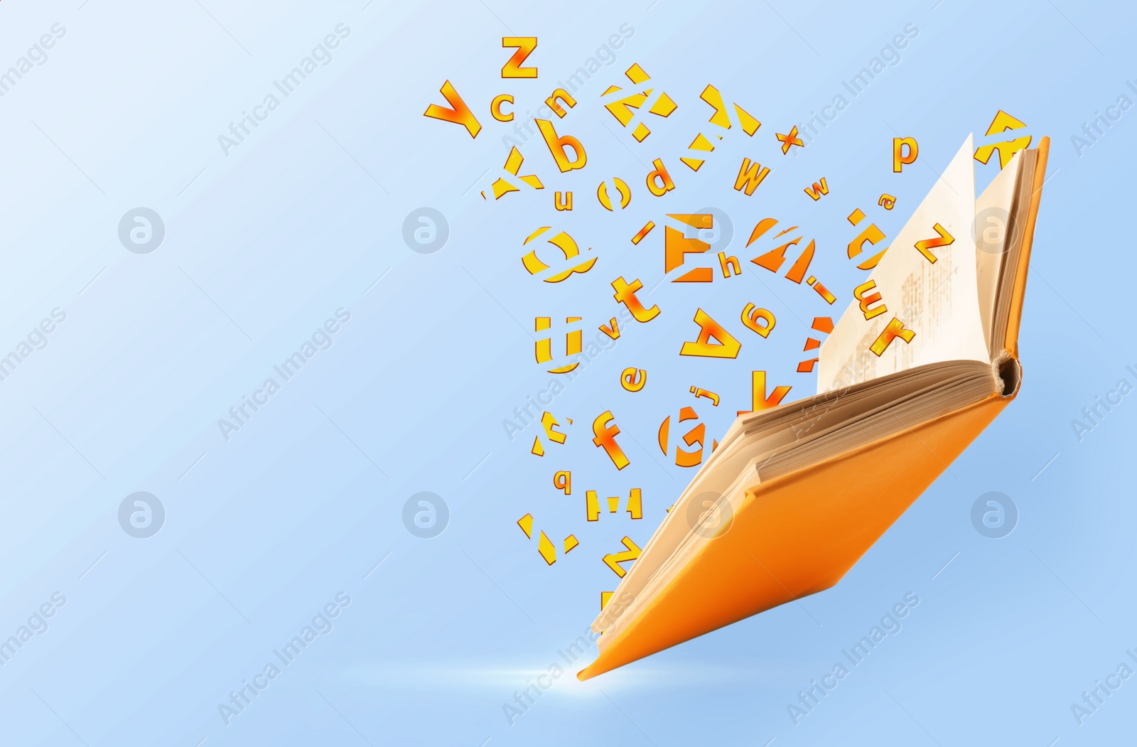 Image of Flying open book with flying letters on light blue background, space for text. Dyslexia concept