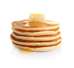 Stack of pancakes with butter and honey on white background