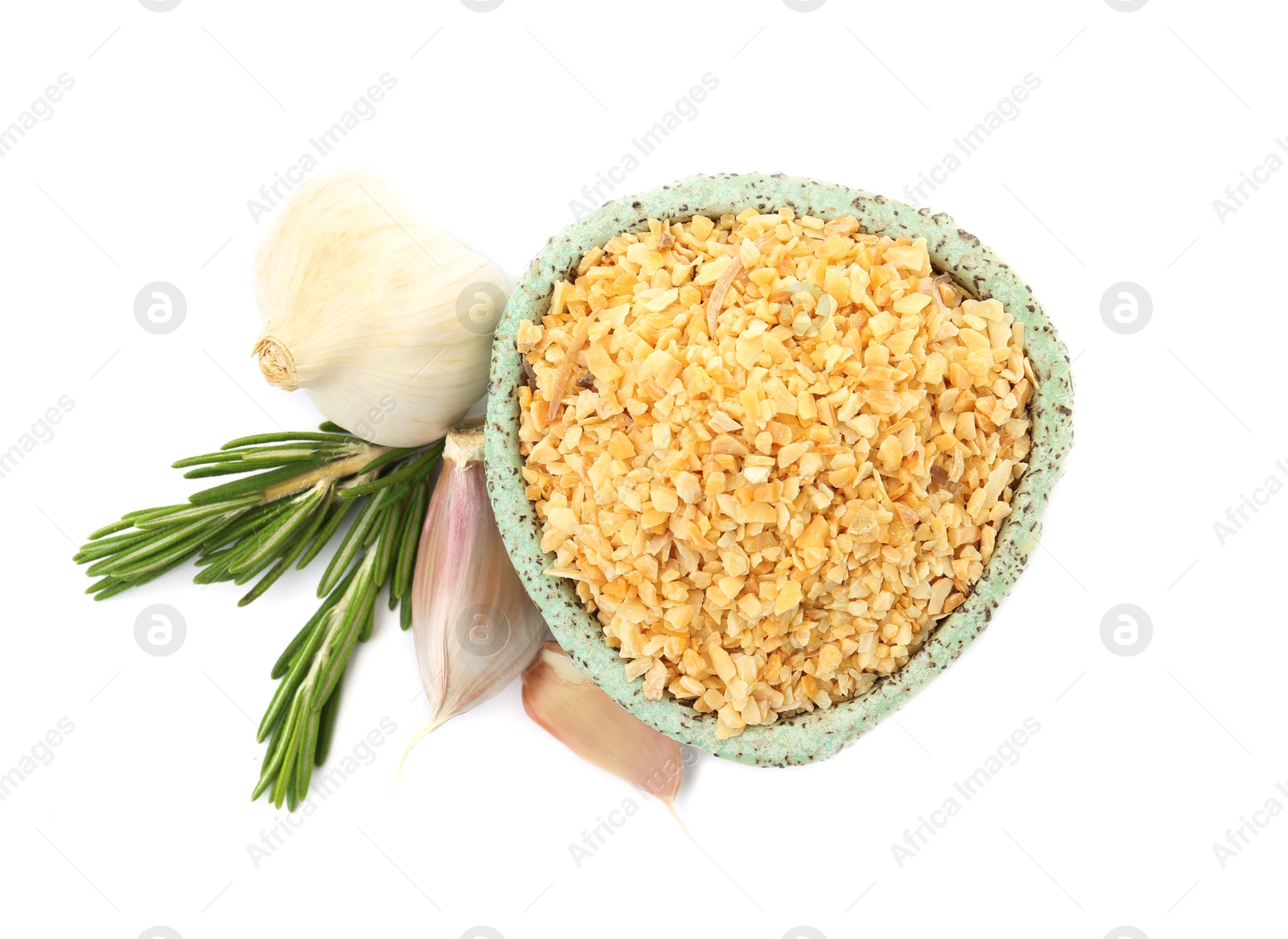 Photo of Bowl of granulated dry garlic and rosemary on white background, top view