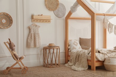 Stylish child room interior with house bed