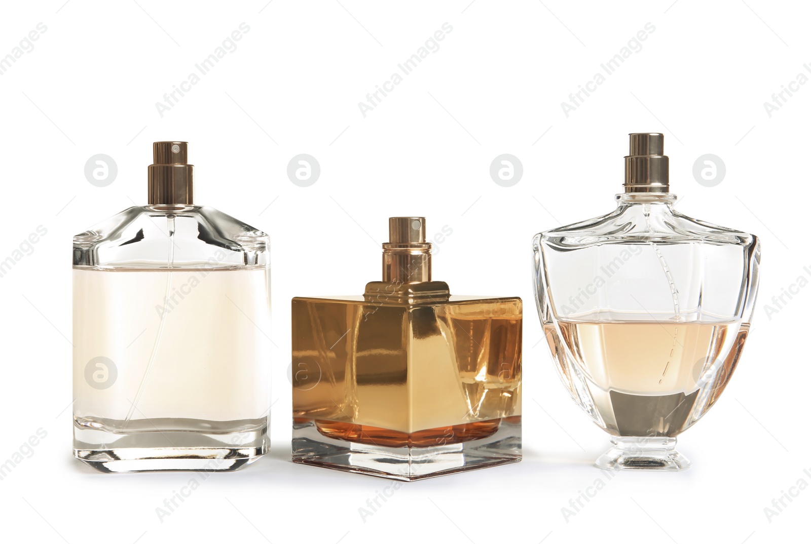 Photo of Different perfume bottles on white background