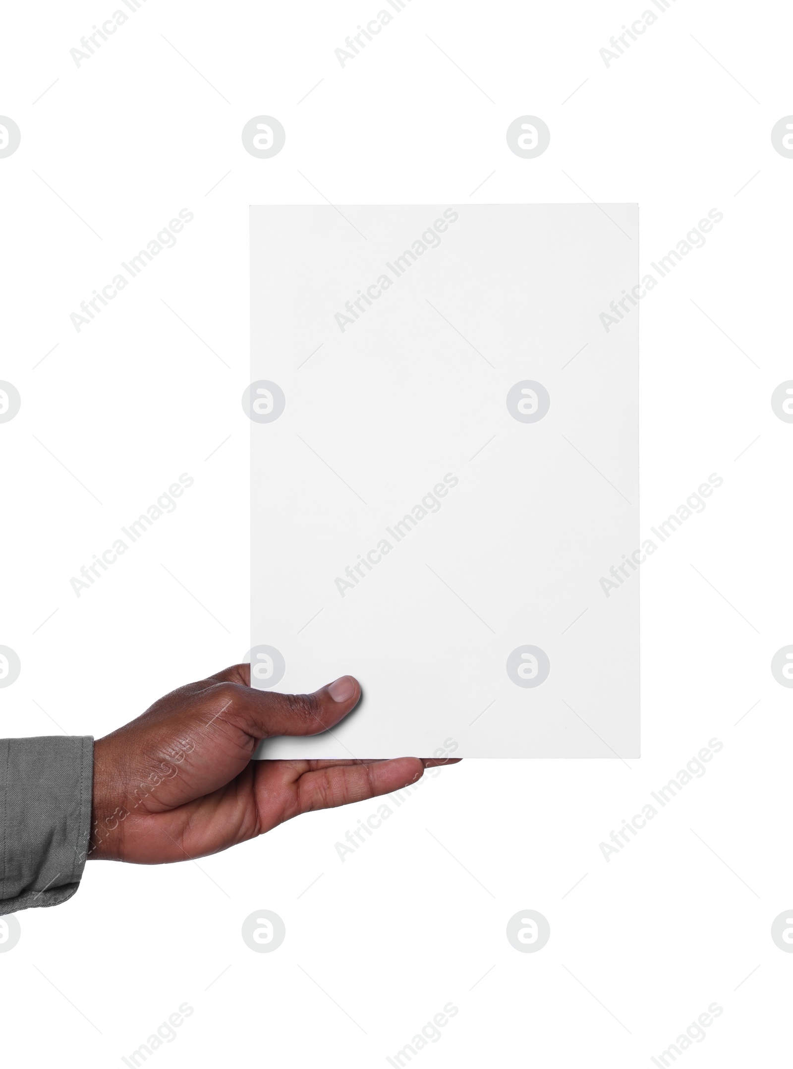 Photo of African American man holding sheet of paper on white background, closeup. Mockup for design