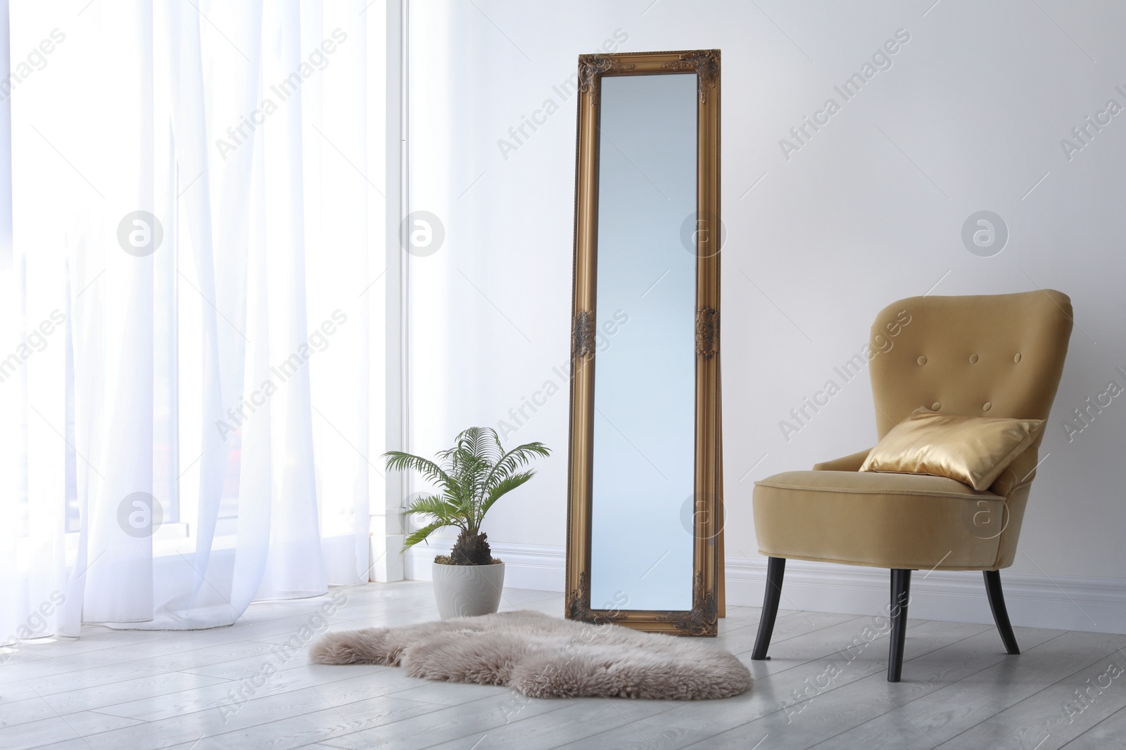 Photo of Elegant room interior with mirror and cozy armchair