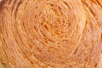 Photo of Tasty puff pastry. Supreme croissant as background, closeup