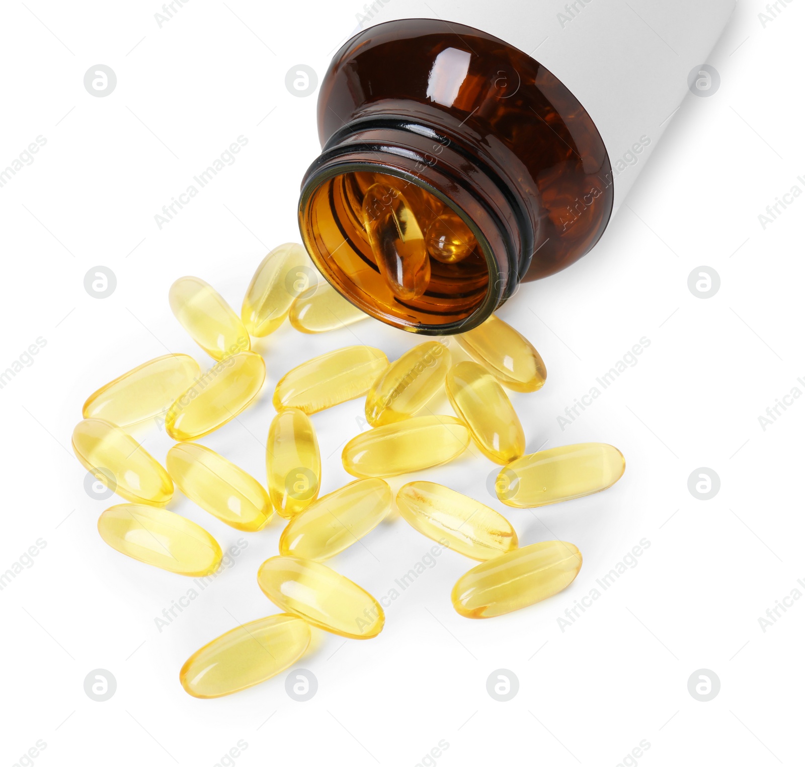 Photo of Scattered softgel capsules and bottle isolated on white