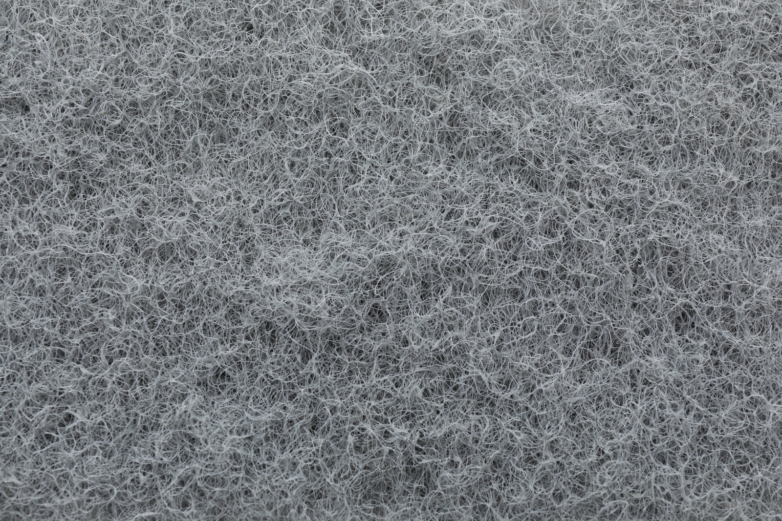 Photo of Grey abrasive cleaning sponge as background, top view