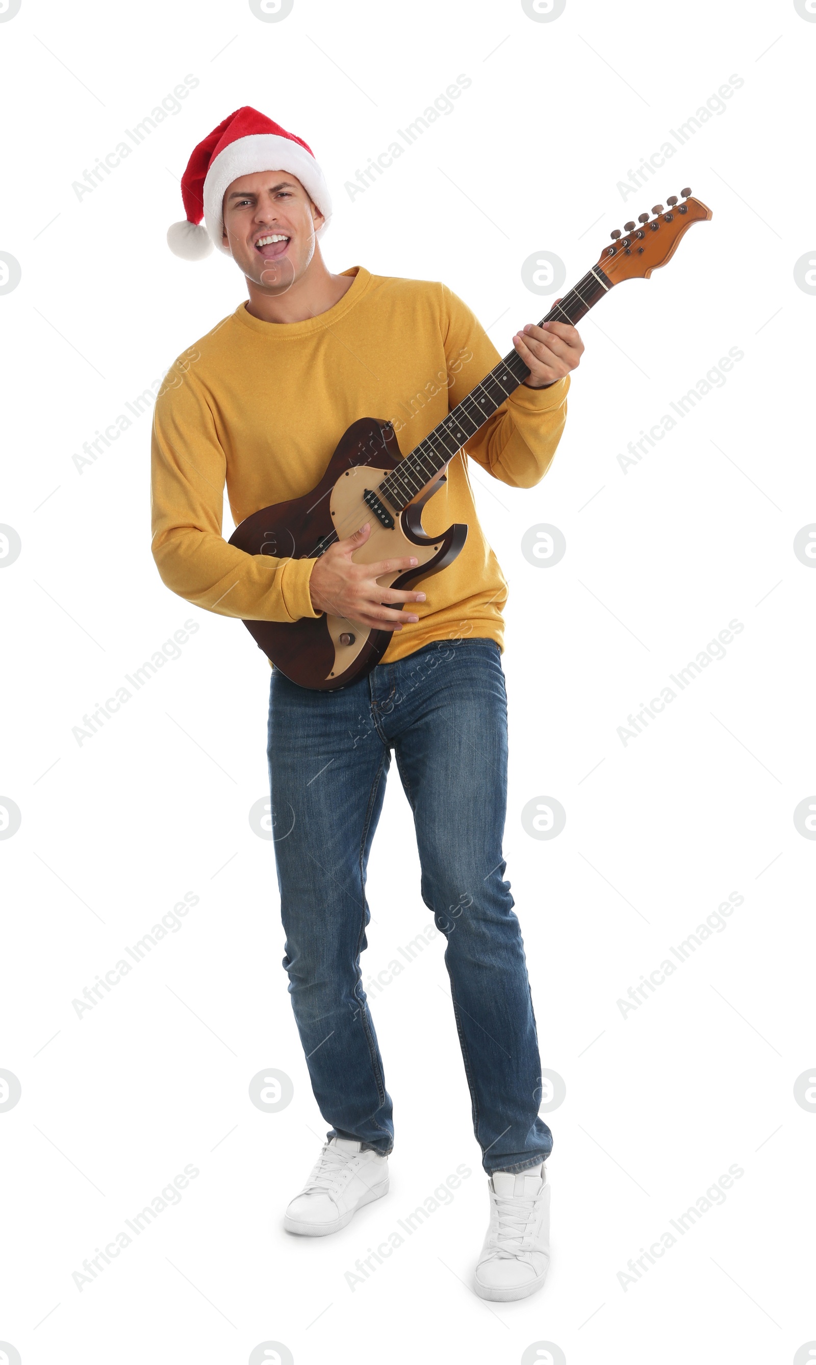 Photo of Man in Santa hat playing electric guitar on white background. Christmas music