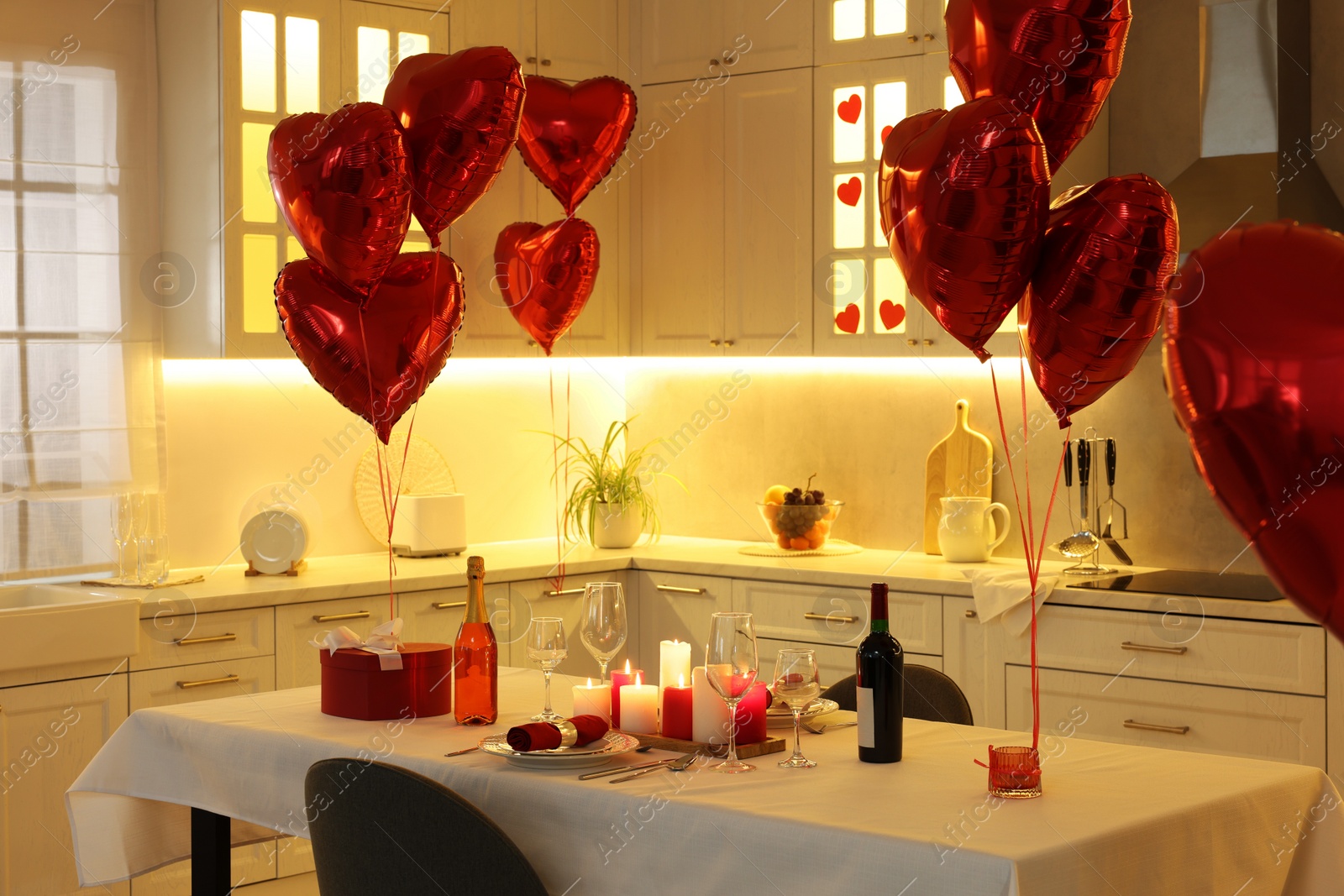 Photo of Romantic atmosphere. Cosy kitchen with set table decorated for Valentine day