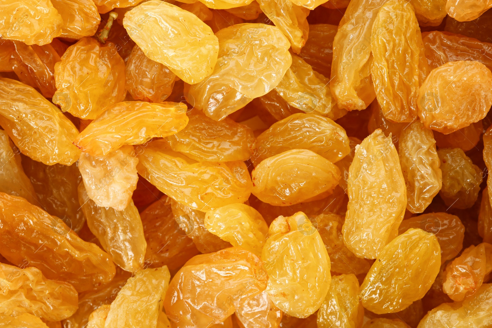 Photo of Tasty raisins as background, top view. Healthy dried fruit