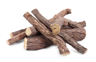 Dried sticks of liquorice root on white background