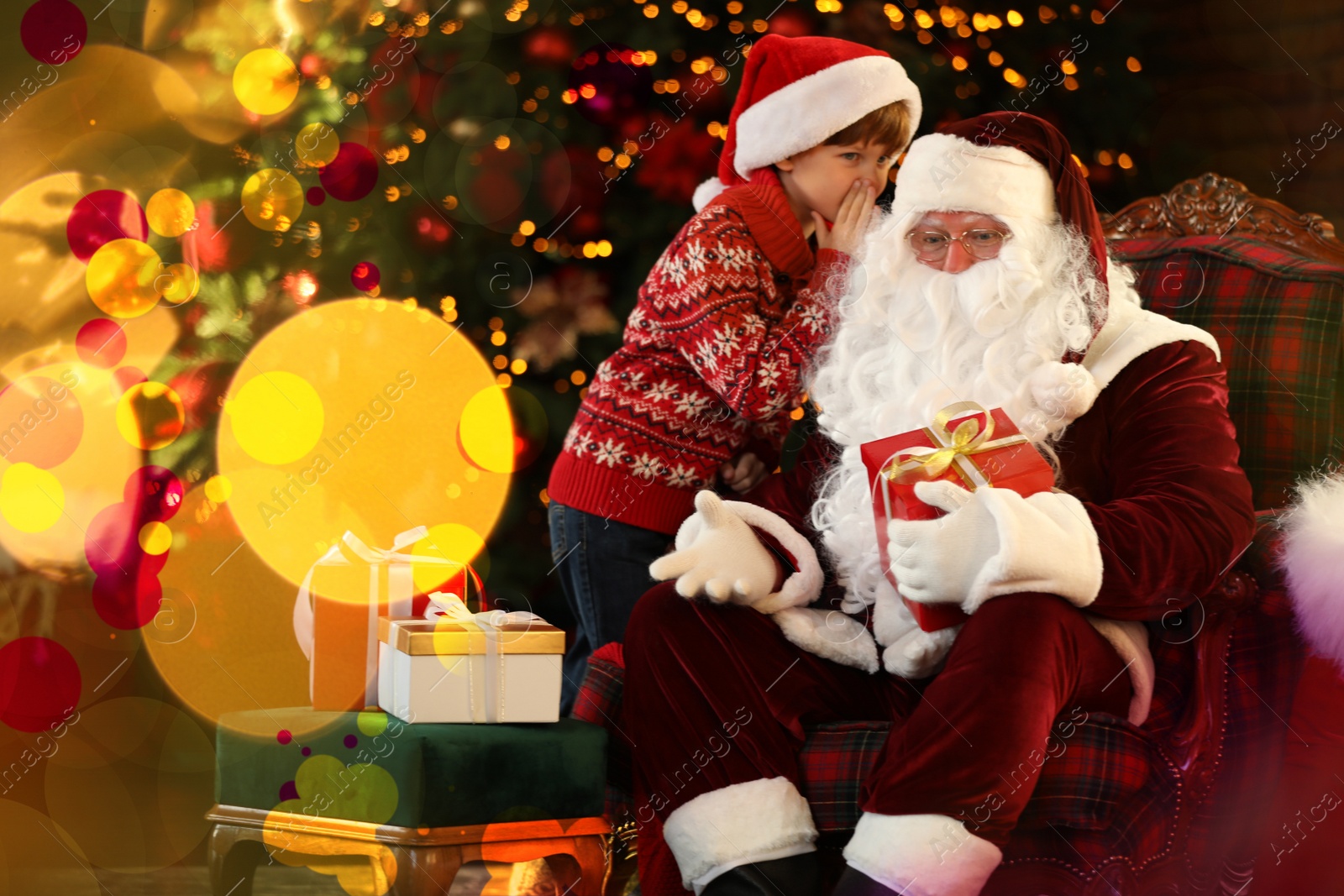 Photo of Santa Claus and little boy near Christmas tree indoors