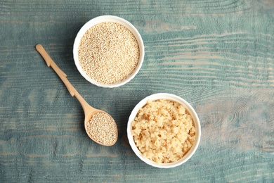 Flat lay composition with raw and cooked quinoa on table