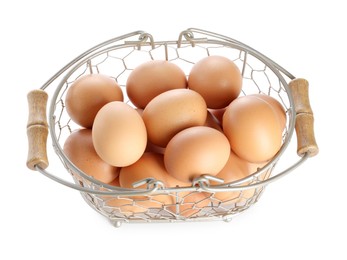 Photo of Chicken eggs in metal basket isolated on white