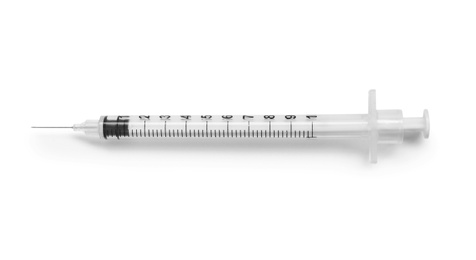 Empty syringe on white background, top view. Medical treatment