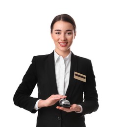 Happy young receptionist in uniform holding service bell on white background