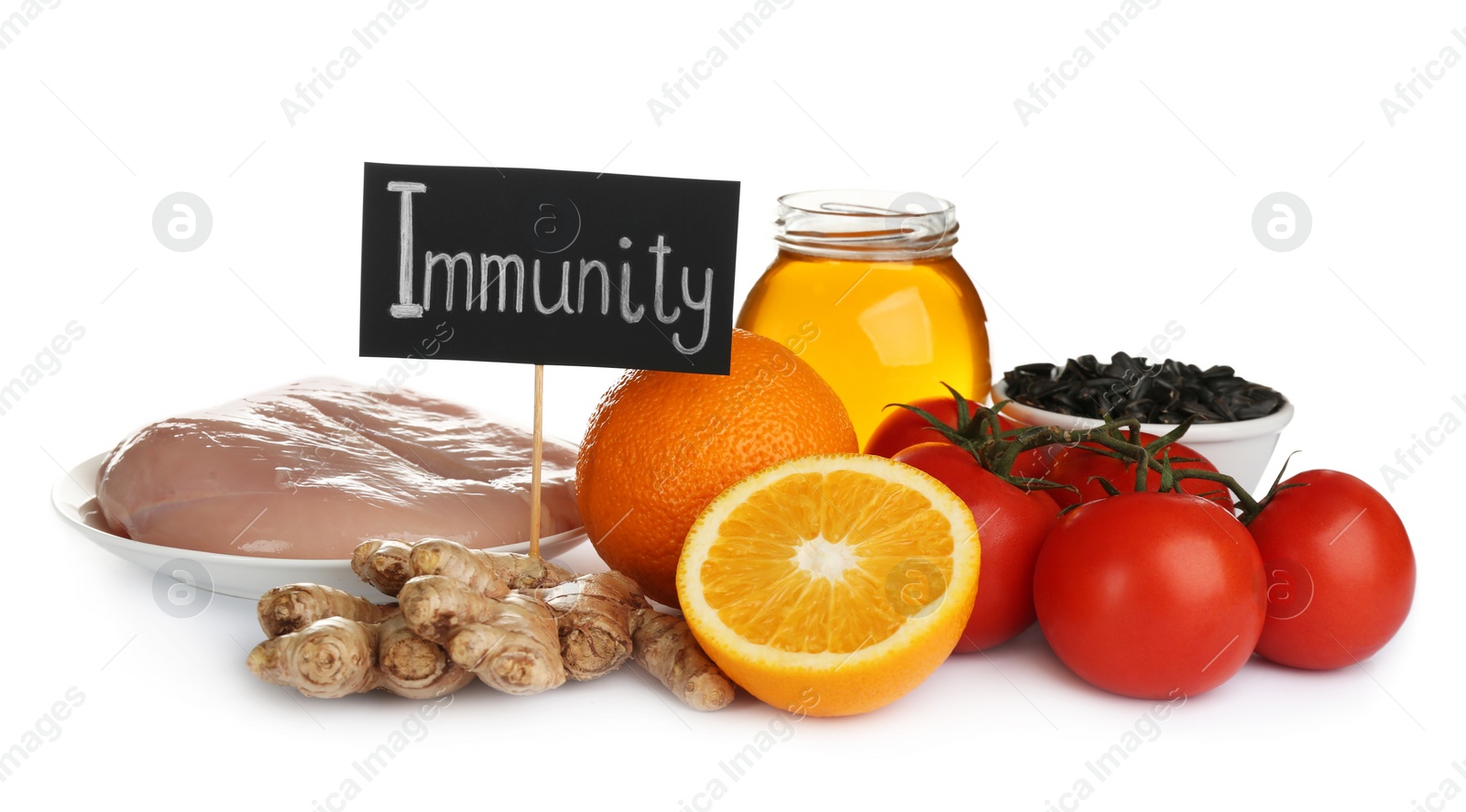 Photo of Set of natural products and card with word Immunity on white background