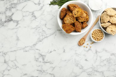 Flat lay composition with soy meat on white marble table. Space for text