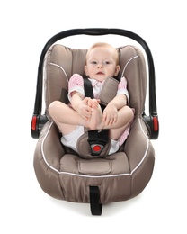 Adorable baby in child safety seat on white background