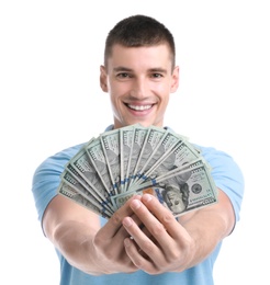 Handsome young man with dollars on white background