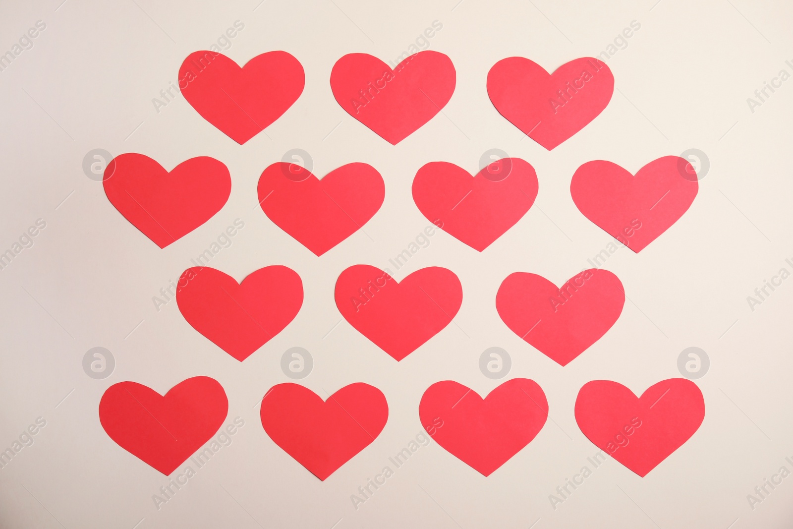 Photo of Small paper hearts on color background, top view